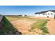 Expansive backyard featuring a new home and a metal storage building at 11564 E Windsor Way, Florence, AZ 85132