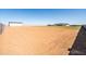 New home and large lot with metal outbuilding and dirt and grassy area at 11564 E Windsor Way, Florence, AZ 85132