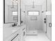 Sleek bathroom featuring double shower heads, a glass partition, and modern fixtures at 11564 E Windsor Way, Florence, AZ 85132
