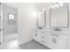 Modern bathroom boasts dual vanity, marble countertops, and sleek finishes at 11564 E Windsor Way, Florence, AZ 85132