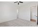 Bright, modern bedroom features neutral carpet, ceiling fan, and white trim at 11564 E Windsor Way, Florence, AZ 85132