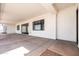 Spacious covered patio features modern windows, recessed lighting, and a concrete floor at 11564 E Windsor Way, Florence, AZ 85132