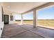 Spacious covered patio with recessed lighting overlooks a large fenced backyard at 11564 E Windsor Way, Florence, AZ 85132