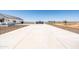 Long driveway leading to a new construction farmhouse at 11564 E Windsor Way, Florence, AZ 85132