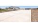 Long driveway leading to a new construction farmhouse with pristine landscaping at 11564 E Windsor Way, Florence, AZ 85132