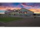 Beautiful home with a well-manicured lawn and desert landscaping at 11564 E Windsor Way, Florence, AZ 85132