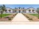 Stunning white modern farmhouse with a black roof, dormer windows and professional landscaping at 11564 E Windsor Way, Florence, AZ 85132