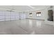 Spacious two-car garage featuring an epoxy floor and plenty of natural light at 11564 E Windsor Way, Florence, AZ 85132