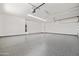 Clean garage features an epoxy floor with room for storage and two cars at 11564 E Windsor Way, Florence, AZ 85132