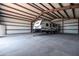 Spacious steel storage building features interior lighting and ample room for RV and equipment storage, with full concrete floor at 11564 E Windsor Way, Florence, AZ 85132