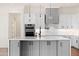 A bright, modern kitchen island featuring a white countertop and black hardware at 11564 E Windsor Way, Florence, AZ 85132