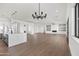 Open floor plan showcasing a spacious living room and kitchen with modern finishes at 11564 E Windsor Way, Florence, AZ 85132