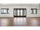 Bright living room with folding glass doors offering seamless indoor-outdoor transition at 11564 E Windsor Way, Florence, AZ 85132