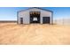 Exterior shot of large steel storage building with roll up doors and ample parking; perfect for RV storage at 11564 E Windsor Way, Florence, AZ 85132