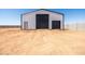 Large steel storage building with roll up doors; great for storing an RV, farm equipment, or as a workshop at 11564 E Windsor Way, Florence, AZ 85132