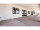 Large covered patio with concrete flooring and seamless access to the backyard at 11564 E Windsor Way, Florence, AZ 85132