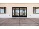 Covered patio showcases large folding doors, connecting indoor and outdoor spaces at 11564 E Windsor Way, Florence, AZ 85132