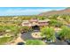 Aerial view of the Ancala Country Club's clubhouse and golf course, with distant mountains in the background at 11773 E Desert Trail Rd, Scottsdale, AZ 85259