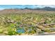 Panoramic aerial view of the community featuring a golf course, tennis courts, and ample parking at 11773 E Desert Trail Rd, Scottsdale, AZ 85259