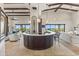 Open concept floor plan with a fully equipped wet bar and plenty of space for entertaining at 11773 E Desert Trail Rd, Scottsdale, AZ 85259
