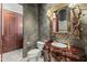 Unique bathroom featuring designer sink with a decorative mirror and lighting at 11773 E Desert Trail Rd, Scottsdale, AZ 85259