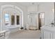 Elegant bathroom featuring tub with chandelier, mosaic tile flooring, and glass enclosed shower at 11773 E Desert Trail Rd, Scottsdale, AZ 85259
