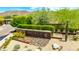 Entrance to Ancala Country Club with attractive landscaping and stone accents at 11773 E Desert Trail Rd, Scottsdale, AZ 85259