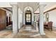 Elegant entryway showcases intricate wrought iron door and leads to a spacious home interior at 11773 E Desert Trail Rd, Scottsdale, AZ 85259