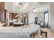 Gourmet kitchen with stone accents, large island, breakfast bar, and adjoining dining area at 11773 E Desert Trail Rd, Scottsdale, AZ 85259