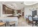 Gourmet kitchen with stone accents, large island, breakfast bar, and adjoining dining area at 11773 E Desert Trail Rd, Scottsdale, AZ 85259