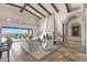 Bright living room boasts a fireplace, comfortable seating, and scenic views through large windows at 11773 E Desert Trail Rd, Scottsdale, AZ 85259