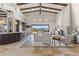 Spacious living area features a fireplace, bar, and seamless access to the outdoor patio and pool at 11773 E Desert Trail Rd, Scottsdale, AZ 85259