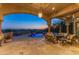 Covered patio featuring comfortable seating and scenic desert views at 11773 E Desert Trail Rd, Scottsdale, AZ 85259