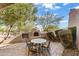 Outdoor dining area with fireplace offering views of the natural landscape at 11773 E Desert Trail Rd, Scottsdale, AZ 85259