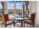 Sitting area with chairs and table, showcasing the scenic mountain views at 11773 E Desert Trail Rd, Scottsdale, AZ 85259