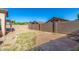 Fenced backyard with paver patio, offering privacy and space for outdoor enjoyment at 1447 E 12Th Pl, Casa Grande, AZ 85122