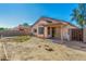 Wide shot of a backyard and covered patio ready for personalization and landscaping at 1447 E 12Th Pl, Casa Grande, AZ 85122