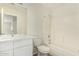 Clean bathroom featuring modern vanity, large mirror, and bathtub with shower at 1447 E 12Th Pl, Casa Grande, AZ 85122