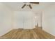 Spacious bedroom featuring neutral walls and wood flooring, offering an open feel at 1447 E 12Th Pl, Casa Grande, AZ 85122