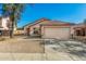 Charming single-story home with a well-maintained front yard and a two-car garage at 1447 E 12Th Pl, Casa Grande, AZ 85122