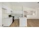 Bright kitchen featuring white cabinetry, stainless steel sink, and updated countertops at 1447 E 12Th Pl, Casa Grande, AZ 85122