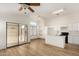 Modern kitchen featuring white cabinetry, wood floors, and access to outdoor living at 1447 E 12Th Pl, Casa Grande, AZ 85122