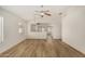 Expansive living room features wood flooring, neutral paint, and an open floor plan at 1447 E 12Th Pl, Casa Grande, AZ 85122