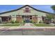 Entrance to a community center with grass, trees, and an overhead awning at 14844 W Pershing St, Surprise, AZ 85379