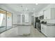 Stylish modern kitchen with stainless steel appliances and a large island at 14844 W Pershing St, Surprise, AZ 85379