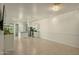 Spacious living area with tile flooring and an open concept design to kitchen at 14844 W Pershing St, Surprise, AZ 85379