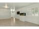 Bright living area with tile floors and a built-in area for an aquarium at 14844 W Pershing St, Surprise, AZ 85379