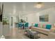 Bright and spacious living area with tile flooring and an open floor plan at 14844 W Pershing St, Surprise, AZ 85379
