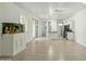 Bright and open-concept living space with tile floors and modern lighting at 14844 W Pershing St, Surprise, AZ 85379
