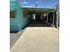 Extended carport and covered patio on the side of a turquoise mobile home at 150 S Windsor Dr # 35, Mesa, AZ 85204
